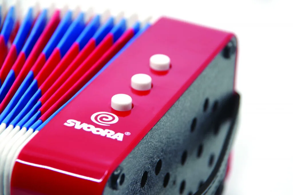 Instrument muzical acordeon rosu